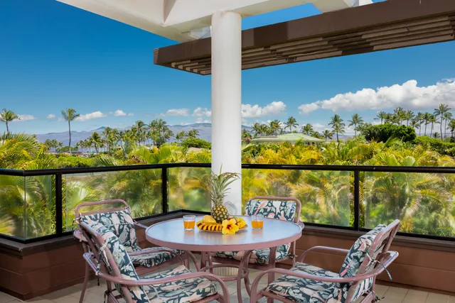 a view of a chairs and table in patio