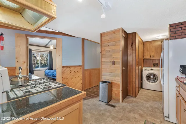 a kitchen that has a stove and a refrigerator