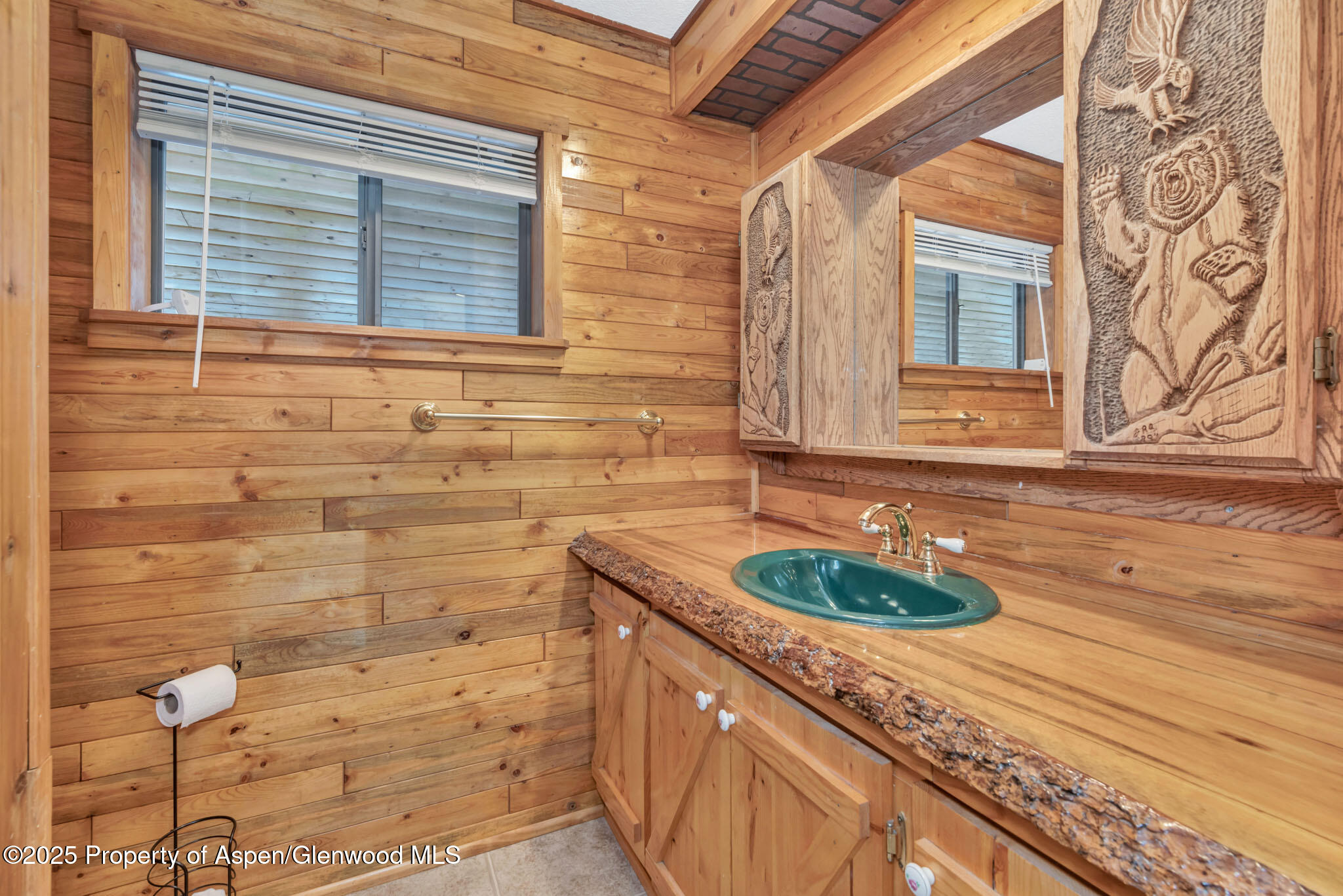 759 Ashley Road Craig, CO 81625 - Photo 18 of 44 a bathroom with a granite countertop sink and a mirror