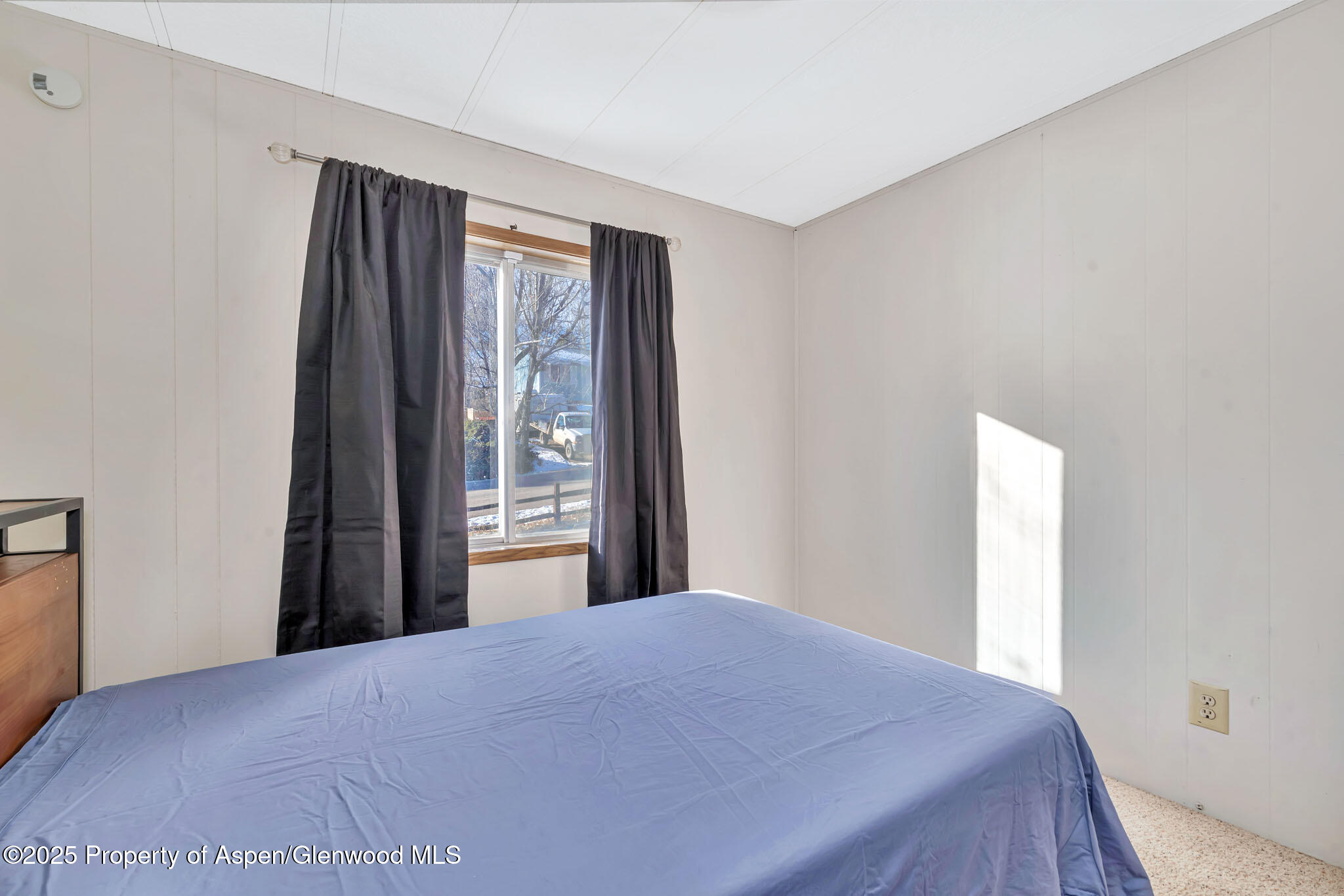 759 Ashley Road Craig, CO 81625 - Photo 26 of 44 a bedroom with a bed and a window