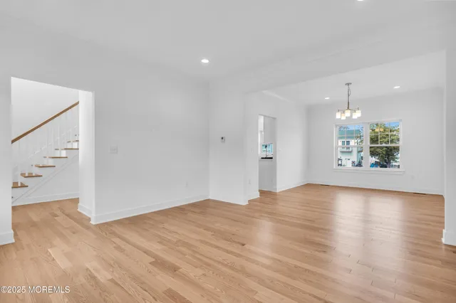 a kitchen with kitchen island a stove a sink a center island and a refrigerator