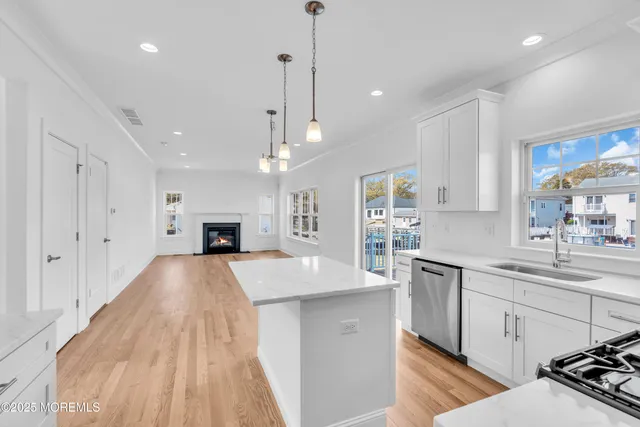 a view of kitchen and window with wooden floor