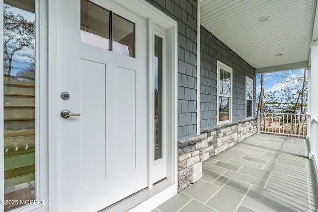 a view of entryway with wooden floor