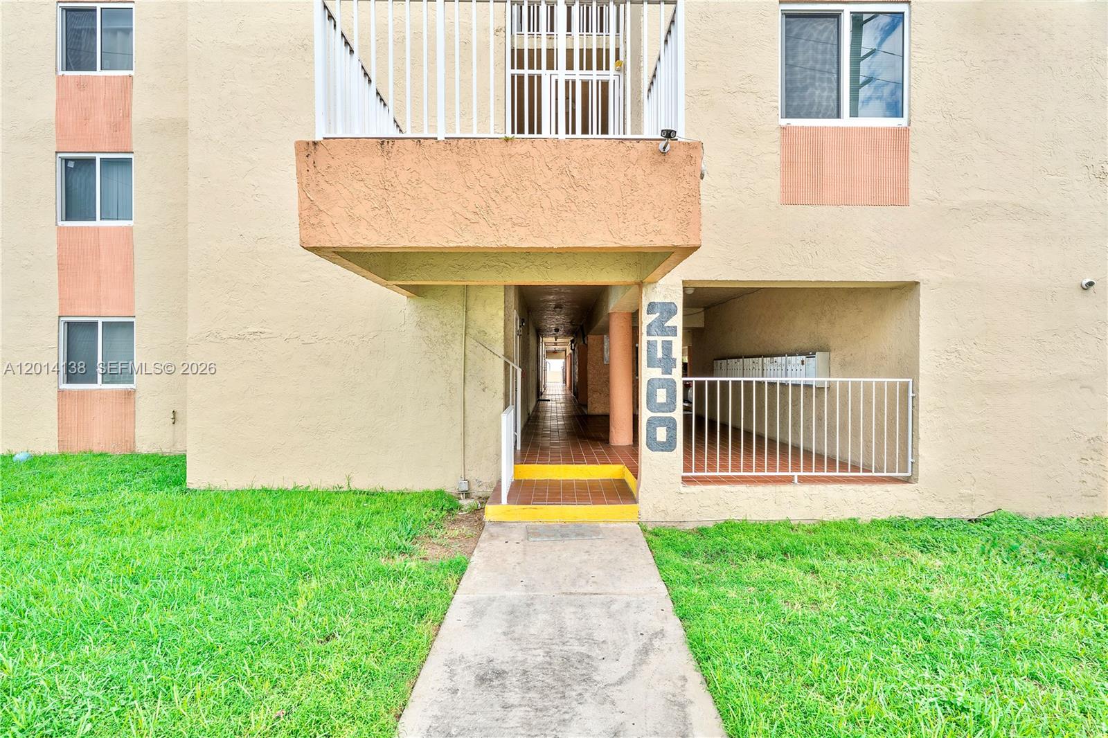 2400 Northwest 16th St Road Miami, FL 33125 - Photo 22 of 47 a view of a brick house with a yard