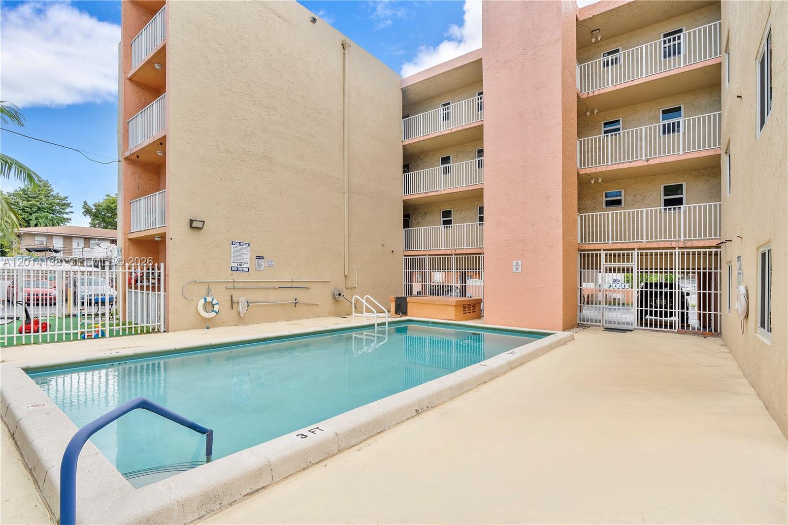 2400 Northwest 16th St Road Miami, FL 33125 - Photo 25 of 47 a view of swimming pool with an outdoor seating