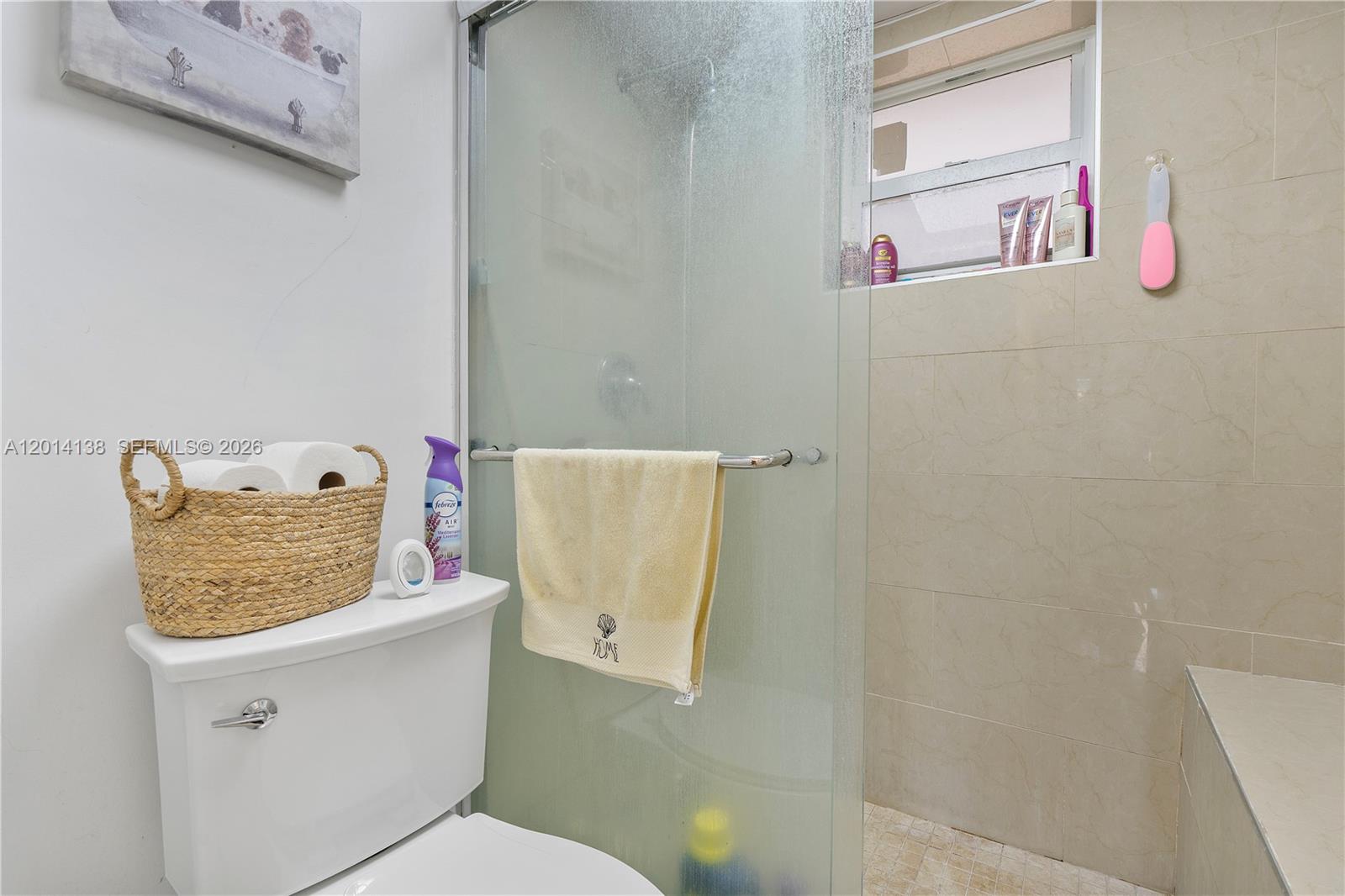 2400 Northwest 16th St Road Miami, FL 33125 - Photo 39 of 47 a bathroom with a shower and a toilet