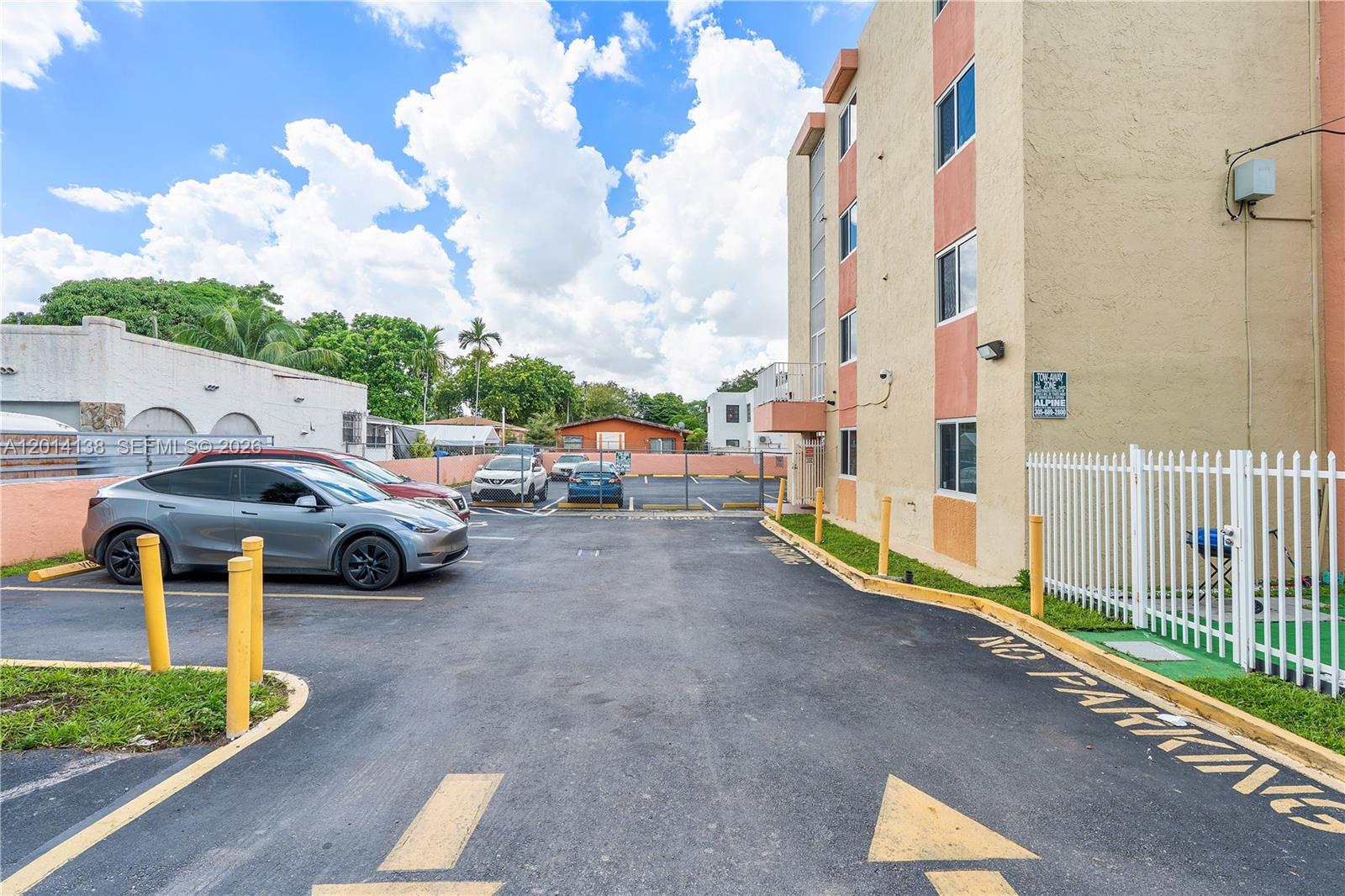 2400 Northwest 16th St Road Miami, FL 33125 - Photo 5 of 47 a view of a street with cars parked
