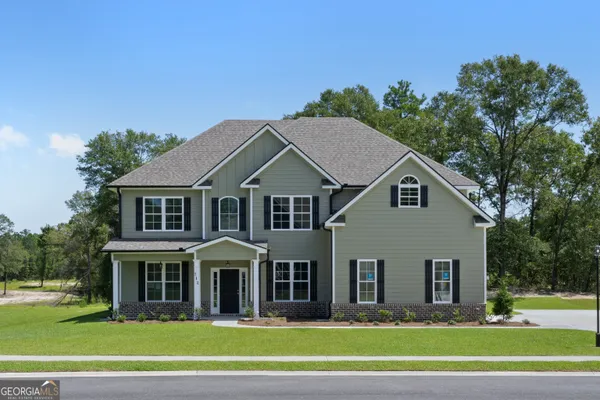a front view of a house with a yard