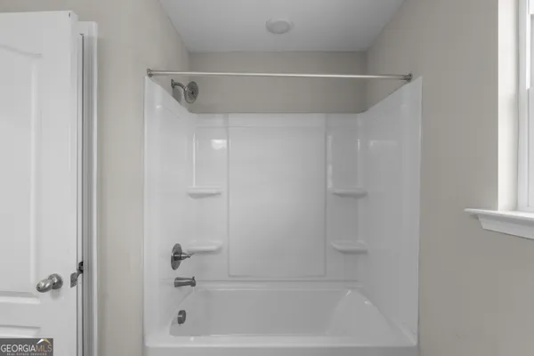 a bathroom with a bathtub