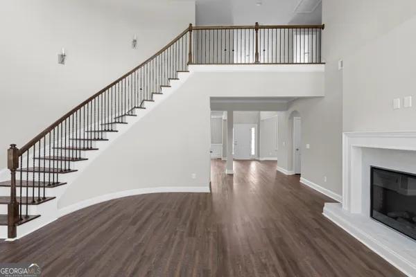 a view of an entryway with wooden floor
