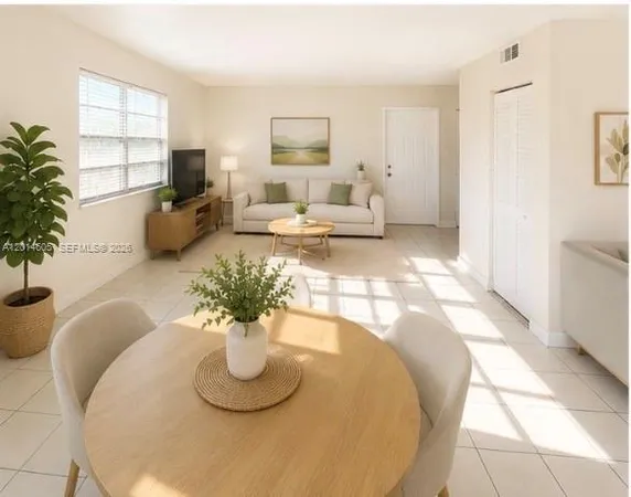 a living room with furniture flowerpot and a window