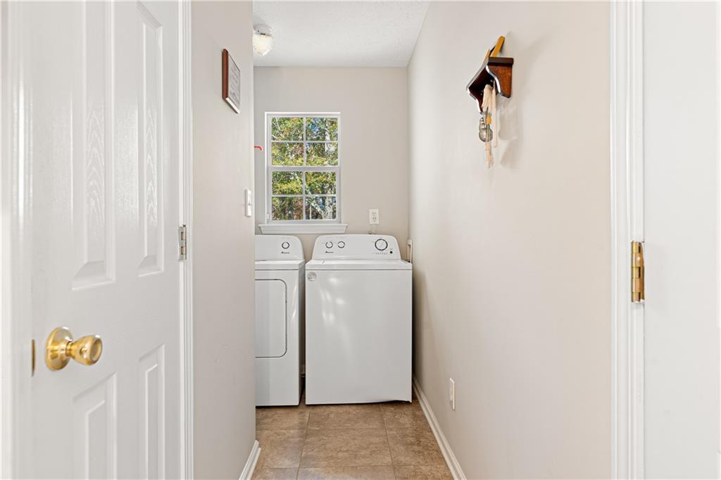 190 Timber Ridge Drive McDonough, GA 30252 - Photo 21 of 29 a utility room with dryer and washer