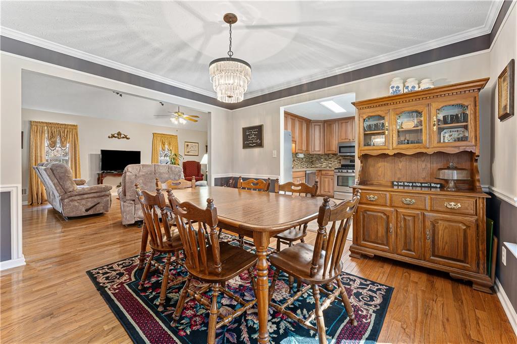 190 Timber Ridge Drive McDonough, GA 30252 - Photo 4 of 29 a view of a dining room with furniture window and wooden floor