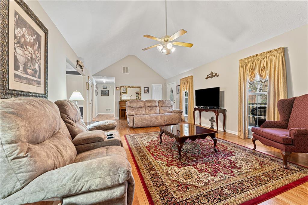 190 Timber Ridge Drive McDonough, GA 30252 - Photo 8 of 29 a living room with furniture and a flat screen tv