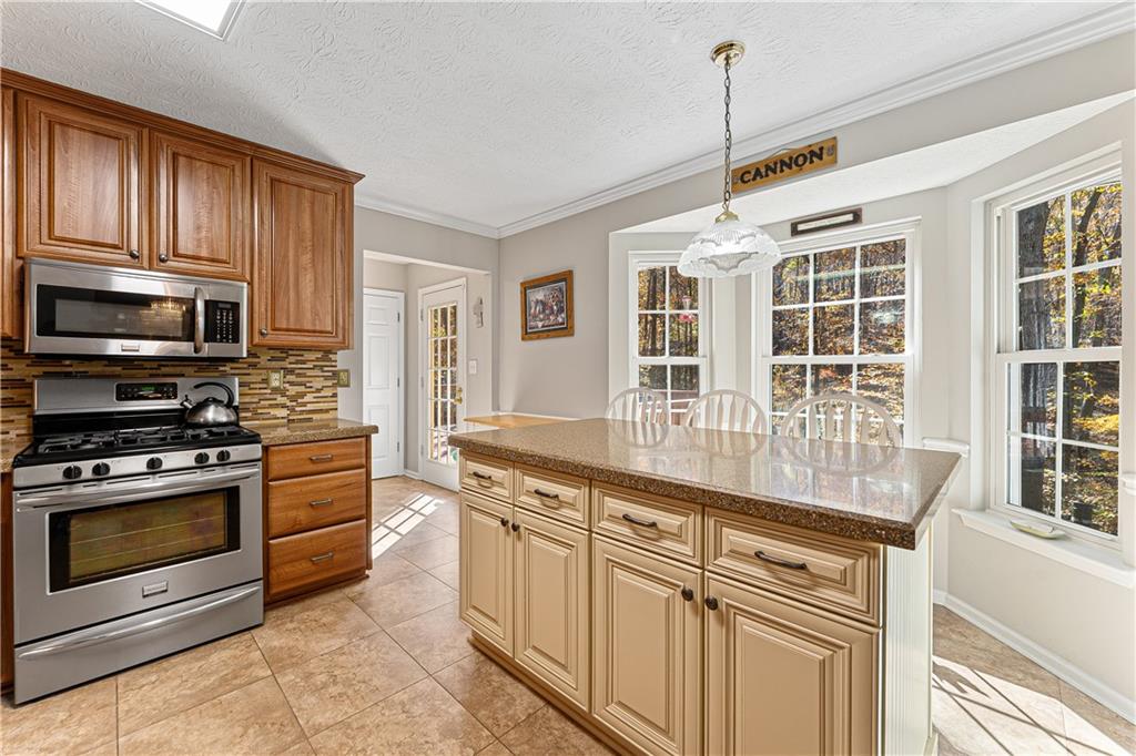 190 Timber Ridge Drive McDonough, GA 30252 - Photo 10 of 29 a kitchen with stainless steel appliances granite countertop a stove and a sink