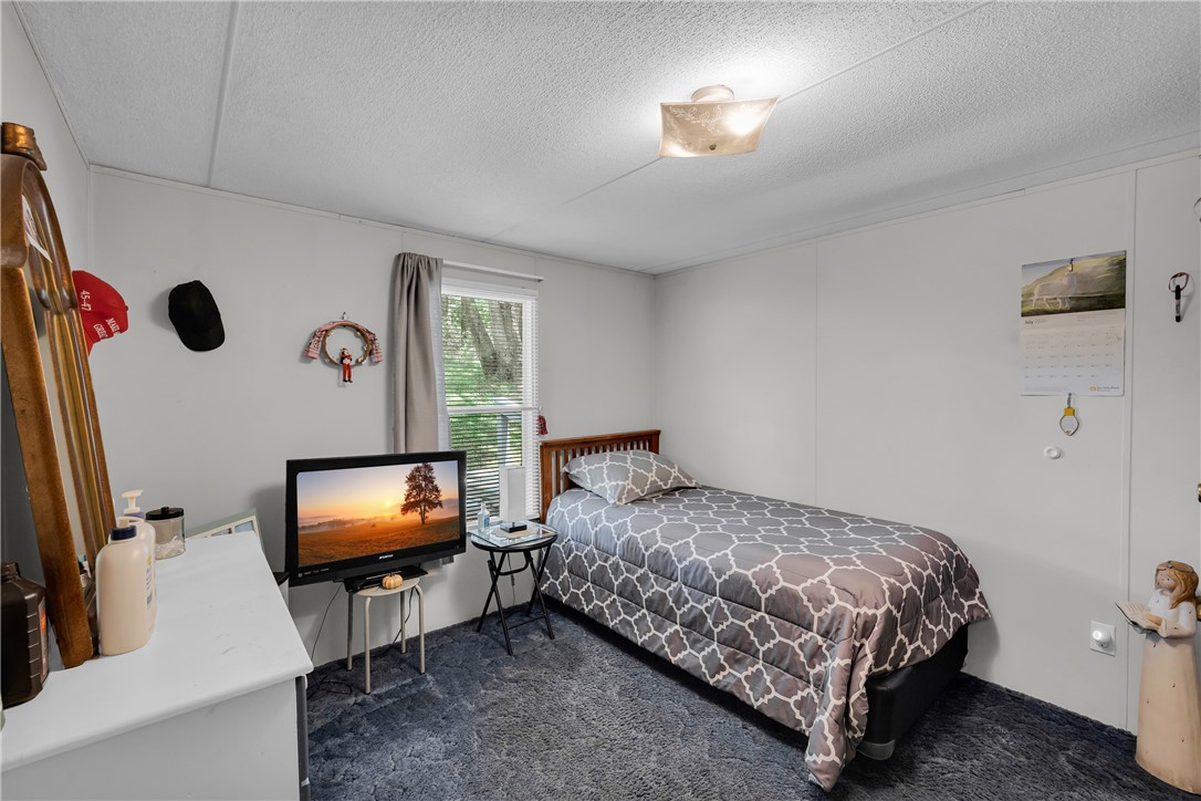 162 Newberry Road Walhalla, SC 29691 - Photo 22 of 50 A cozy retreat awaits, featuring carpeted floors and a window offering natural light.
