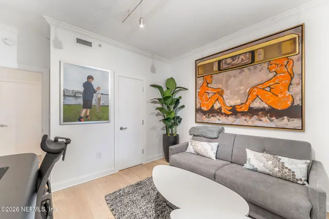 a living room with furniture and a rug