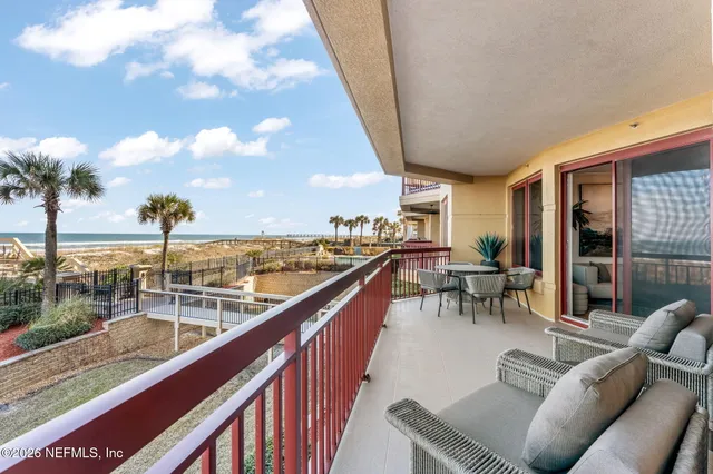 a view of a balcony with chairs