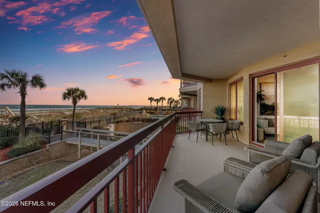 a view of a chairs and table in patio