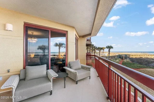 a balcony with furniture and city view