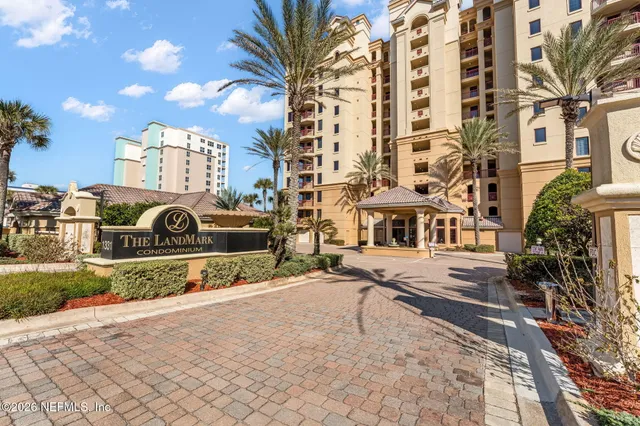 a lobby with furniture and floor to ceiling window