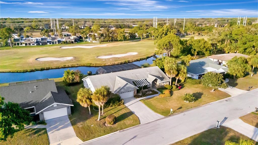 4859 Greencroft Road Sarasota, FL 34235 - Photo 1 of 39 an aerial view of residential houses with outdoor space