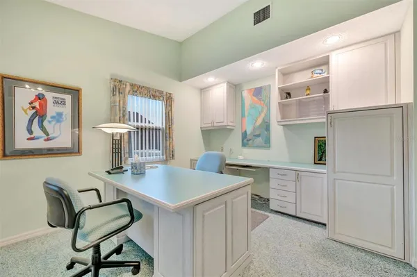 a view of kitchen with furniture and window