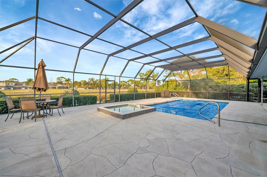 4859 Greencroft Road Sarasota, FL 34235 - Photo 35 of 39 a view of a swimming pool with a patio