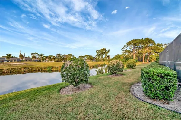 a view of a pathway with a yard