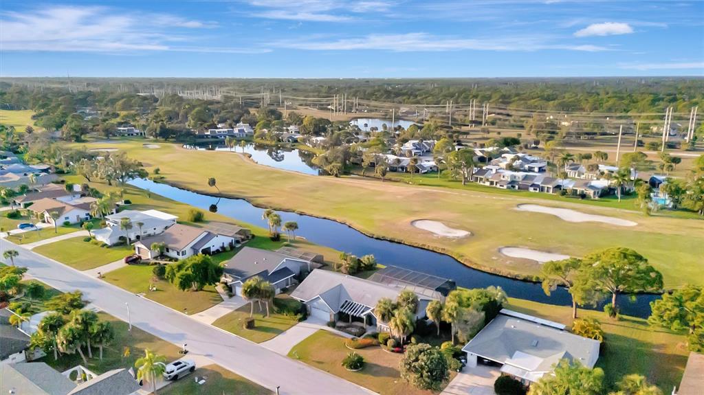 4859 Greencroft Road Sarasota, FL 34235 - Photo 39 of 39 an aerial view of ocean and residential houses with outdoor space
