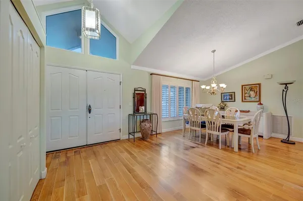 a view of a dining room with furniture window and wooden floor