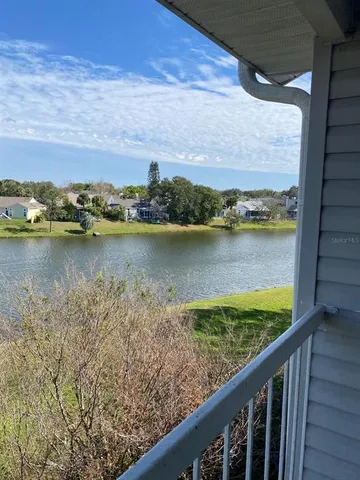 a view of a lake from a balcony