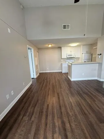 a view of kitchen and wooden floor