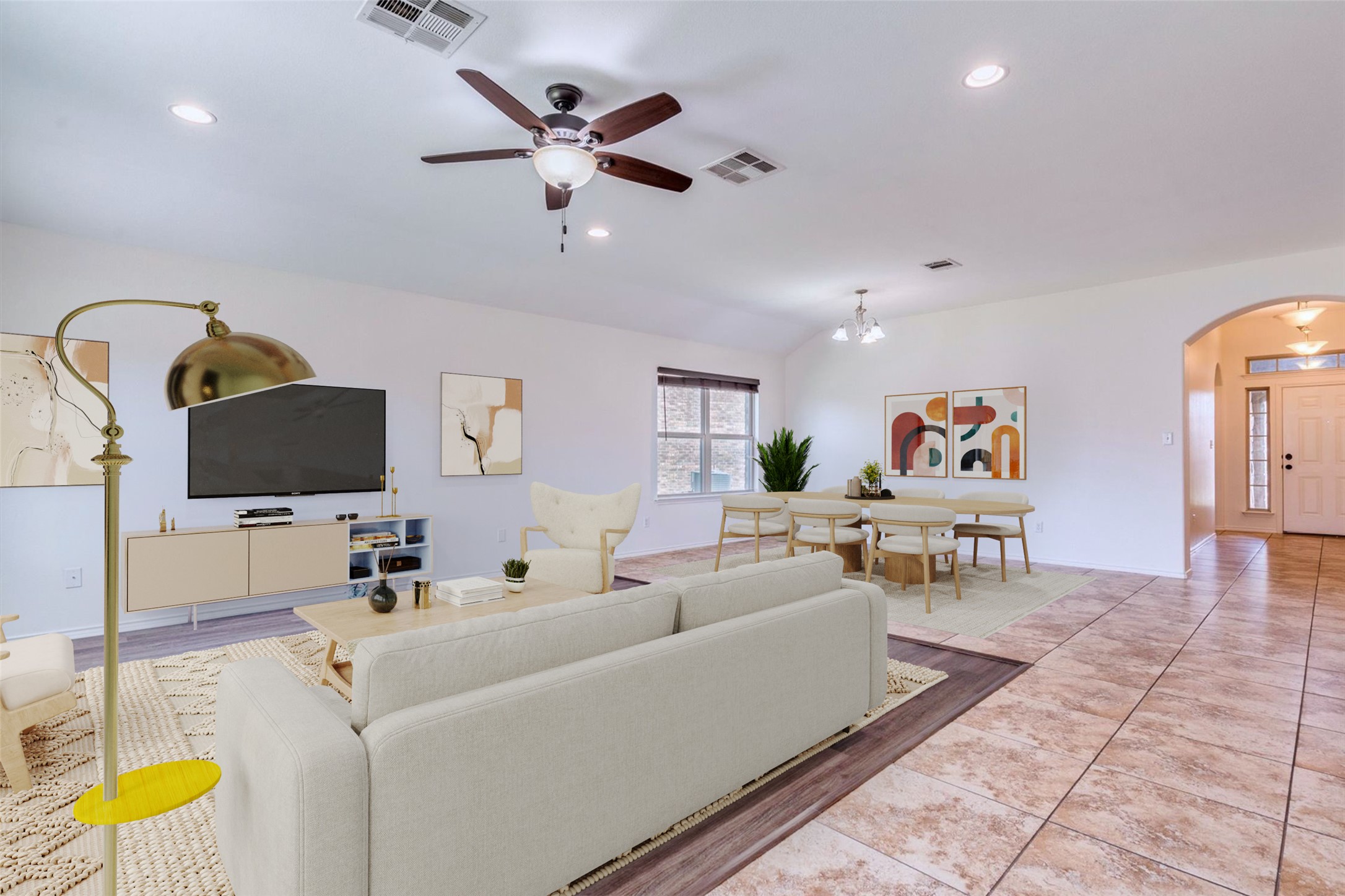 16829 Ruggio Road Pflugerville, TX 78660 - Photo 15 of 40 a living room with furniture and a flat screen tv
