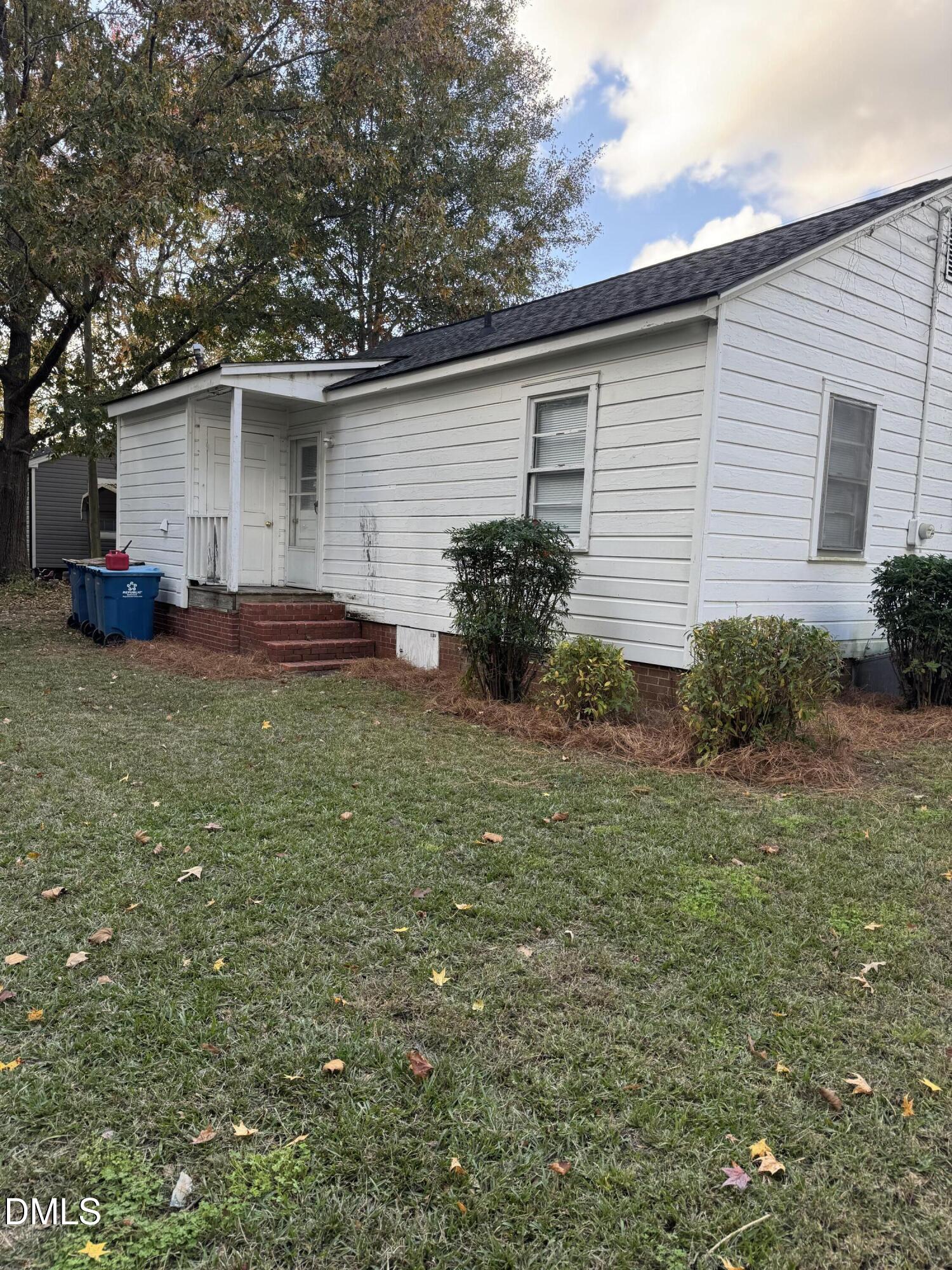 101 Joy Street Dunn, NC 28334 - Photo 12 of 14 a view of a house with backyard