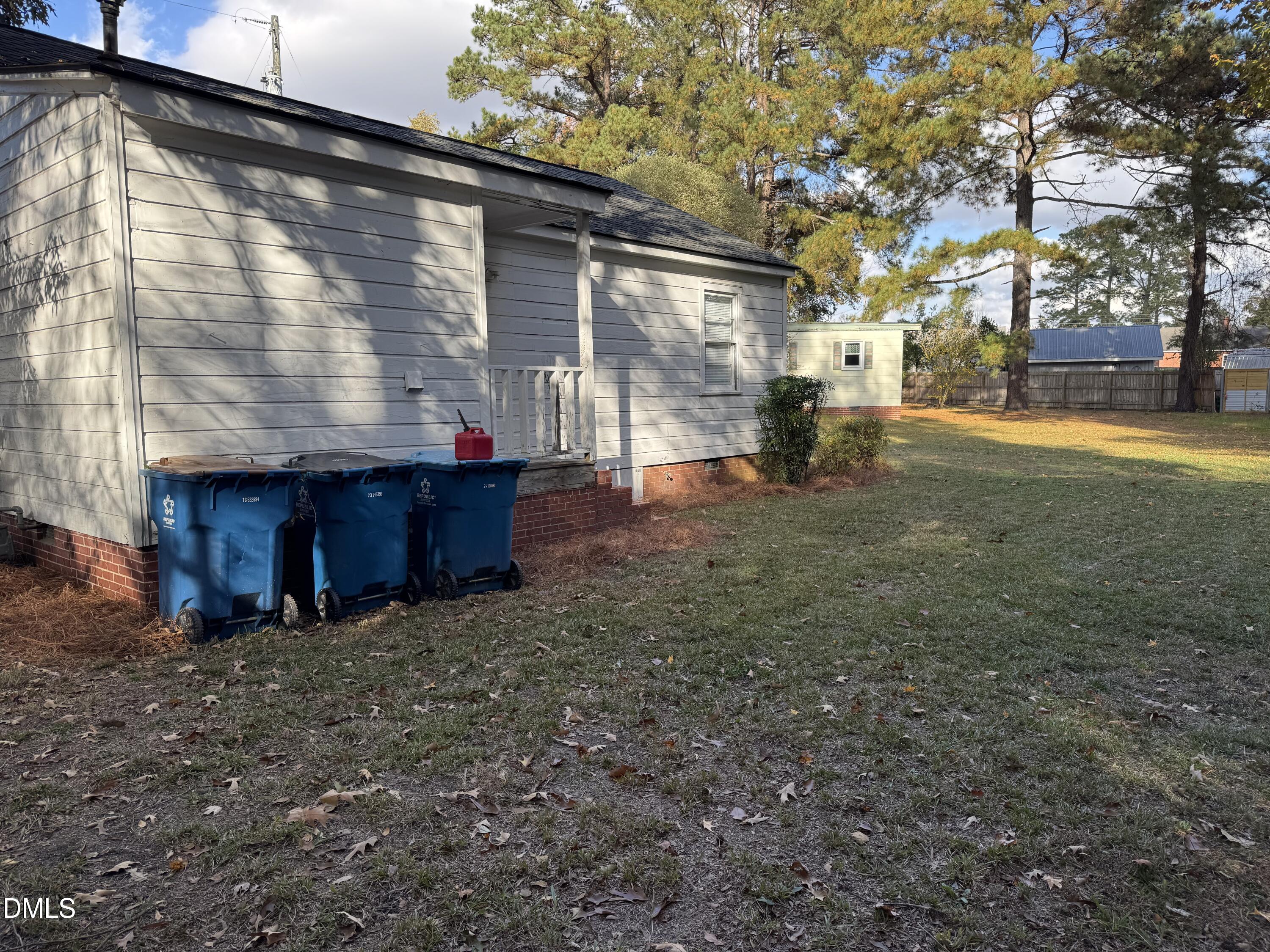 101 Joy Street Dunn, NC 28334 - Photo 13 of 14 a view of a house with a yard
