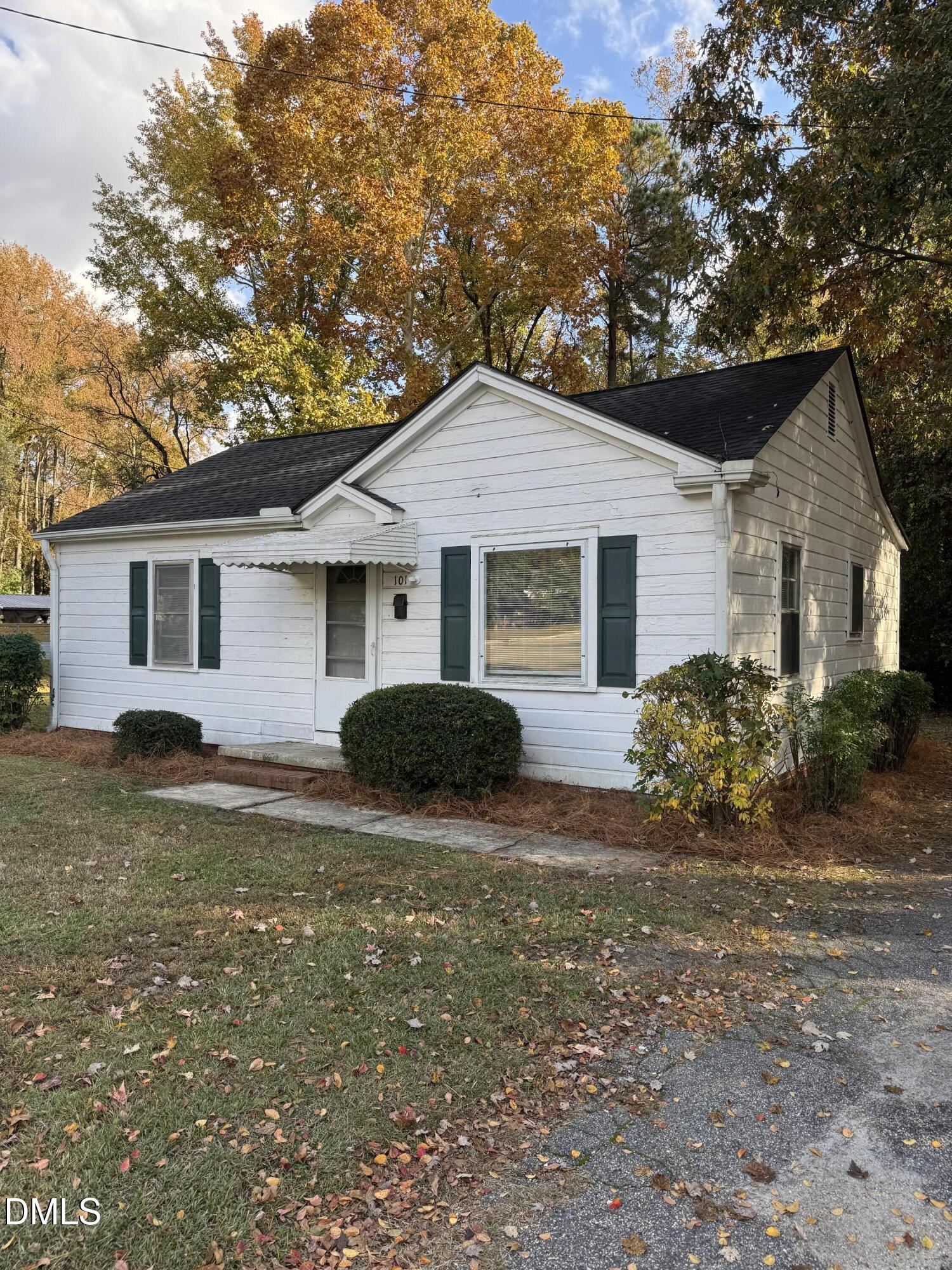 101 Joy Street Dunn, NC 28334 - Photo 2 of 14 a house view with a garden space
