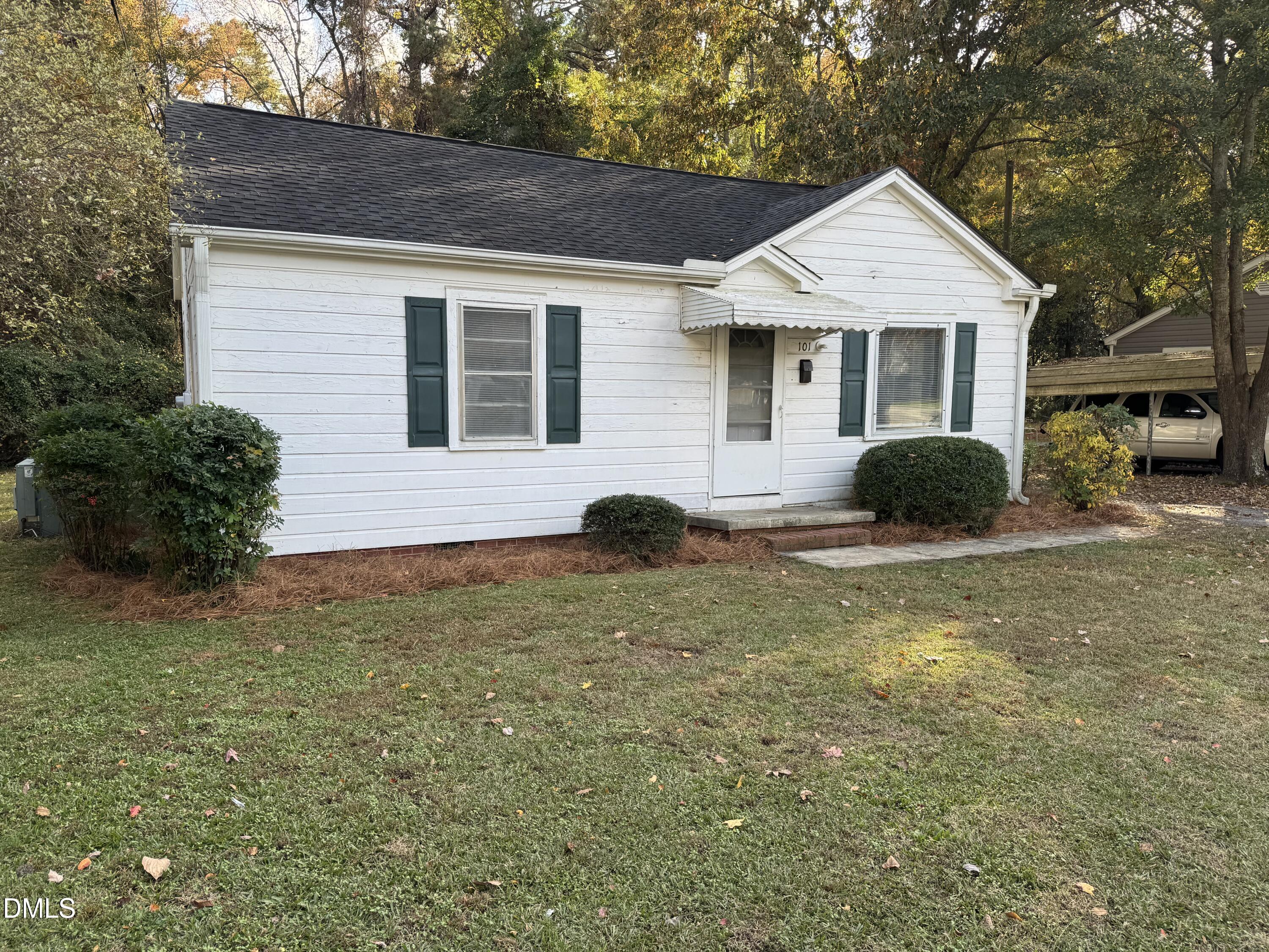101 Joy Street Dunn, NC 28334 - Photo 4 of 14 a house view with a garden space
