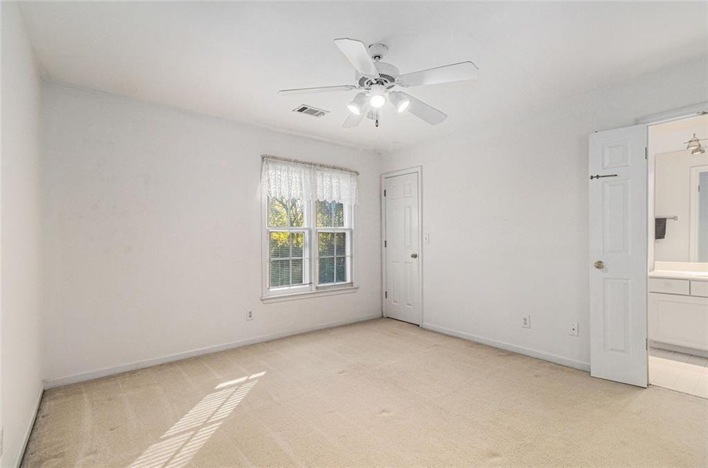2653 Danforth Lane Decatur, GA 30033 - Photo 19 of 30 an empty room with chandelier fan and windows