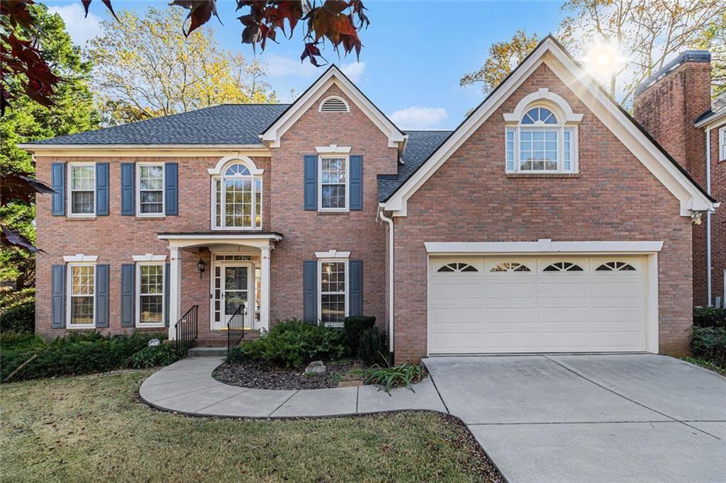 2653 Danforth Lane Decatur, GA 30033 - Photo 2 of 30 a front view of a house with a yard and garage