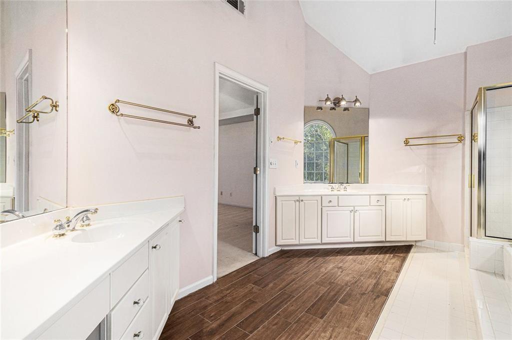 2653 Danforth Lane Decatur, GA 30033 - Photo 24 of 30 a bathroom with a sink a mirror and a shower