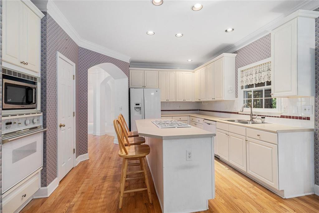 2653 Danforth Lane Decatur, GA 30033 - Photo 8 of 30 a kitchen with stainless steel appliances granite countertop a stove a sink and a refrigerator