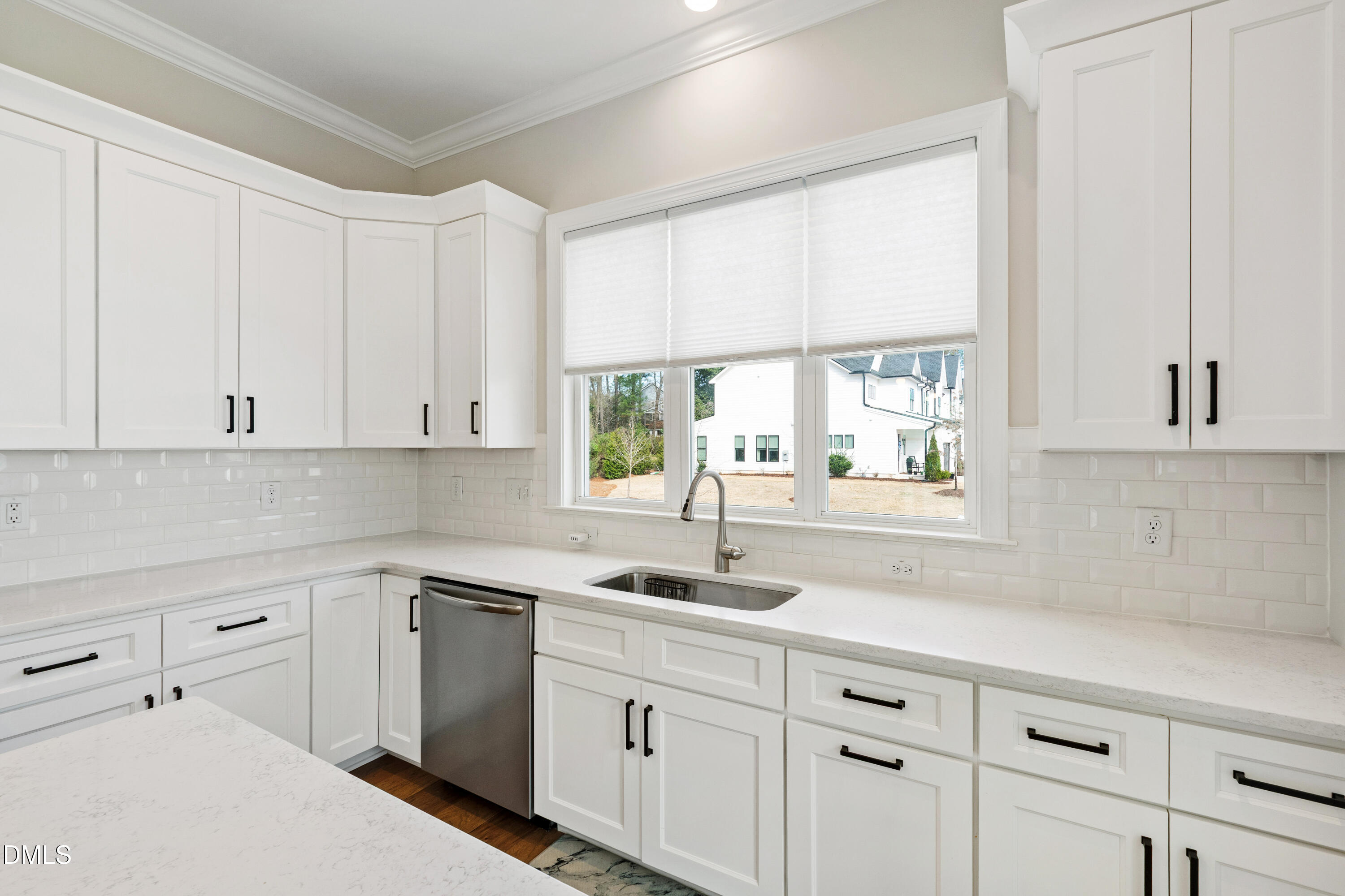 4934 Trek Lane Raleigh, NC 27606 - Photo 11 of 35 a kitchen with white cabinets and white appliances
