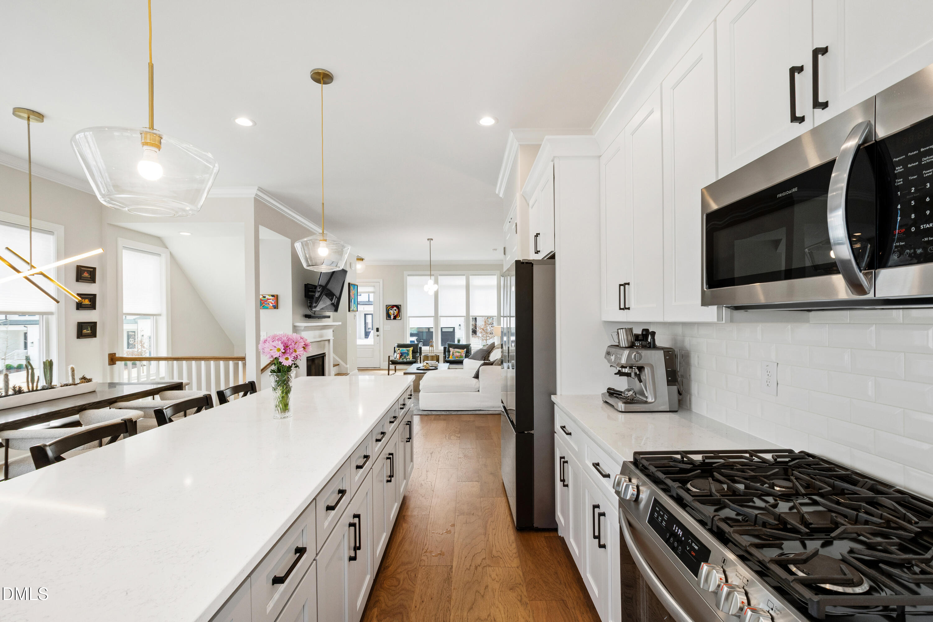 4934 Trek Lane Raleigh, NC 27606 - Photo 12 of 35 a kitchen with a sink stove and microwave