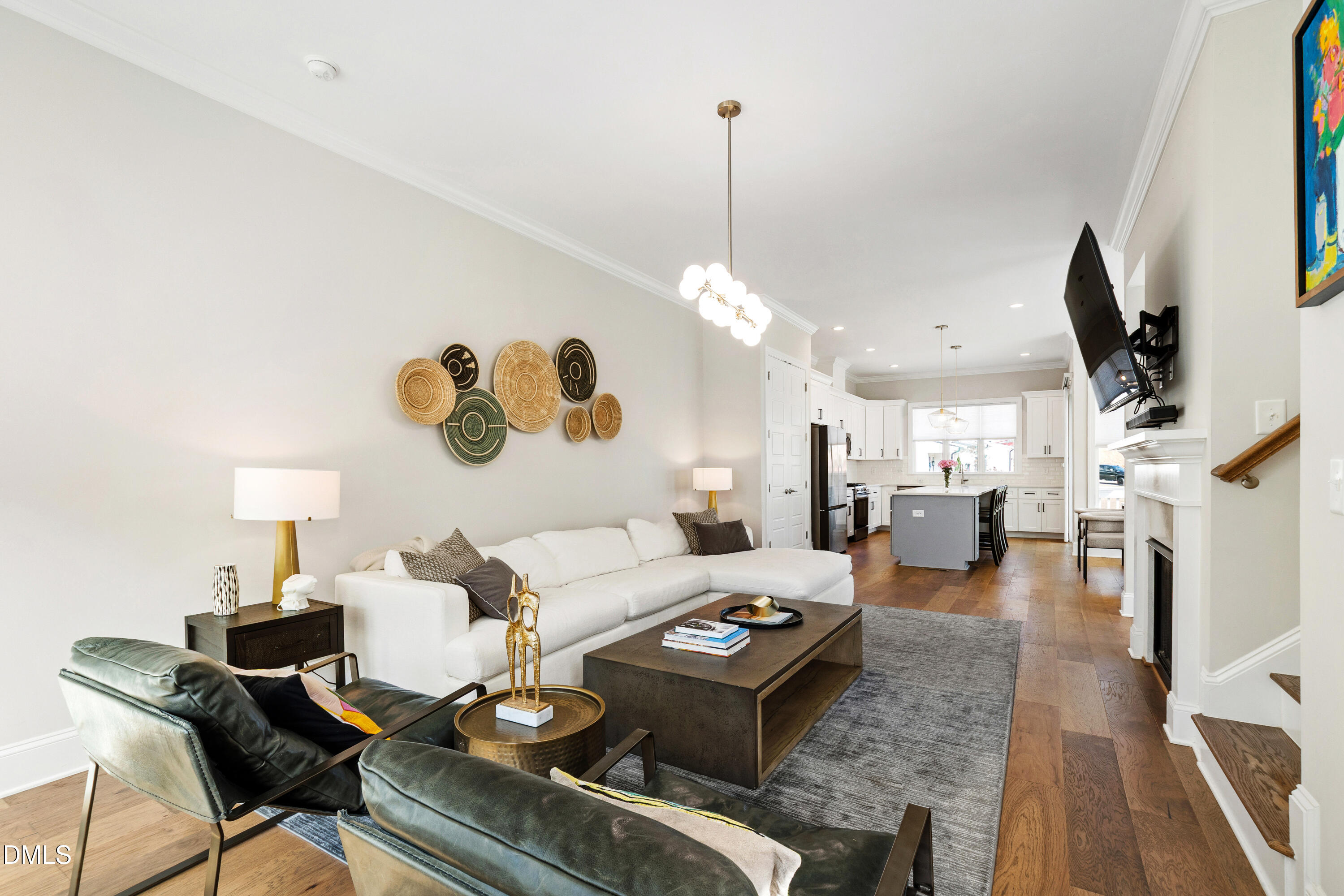 4934 Trek Lane Raleigh, NC 27606 - Photo 15 of 35 a living room with lots of furniture and a chandelier