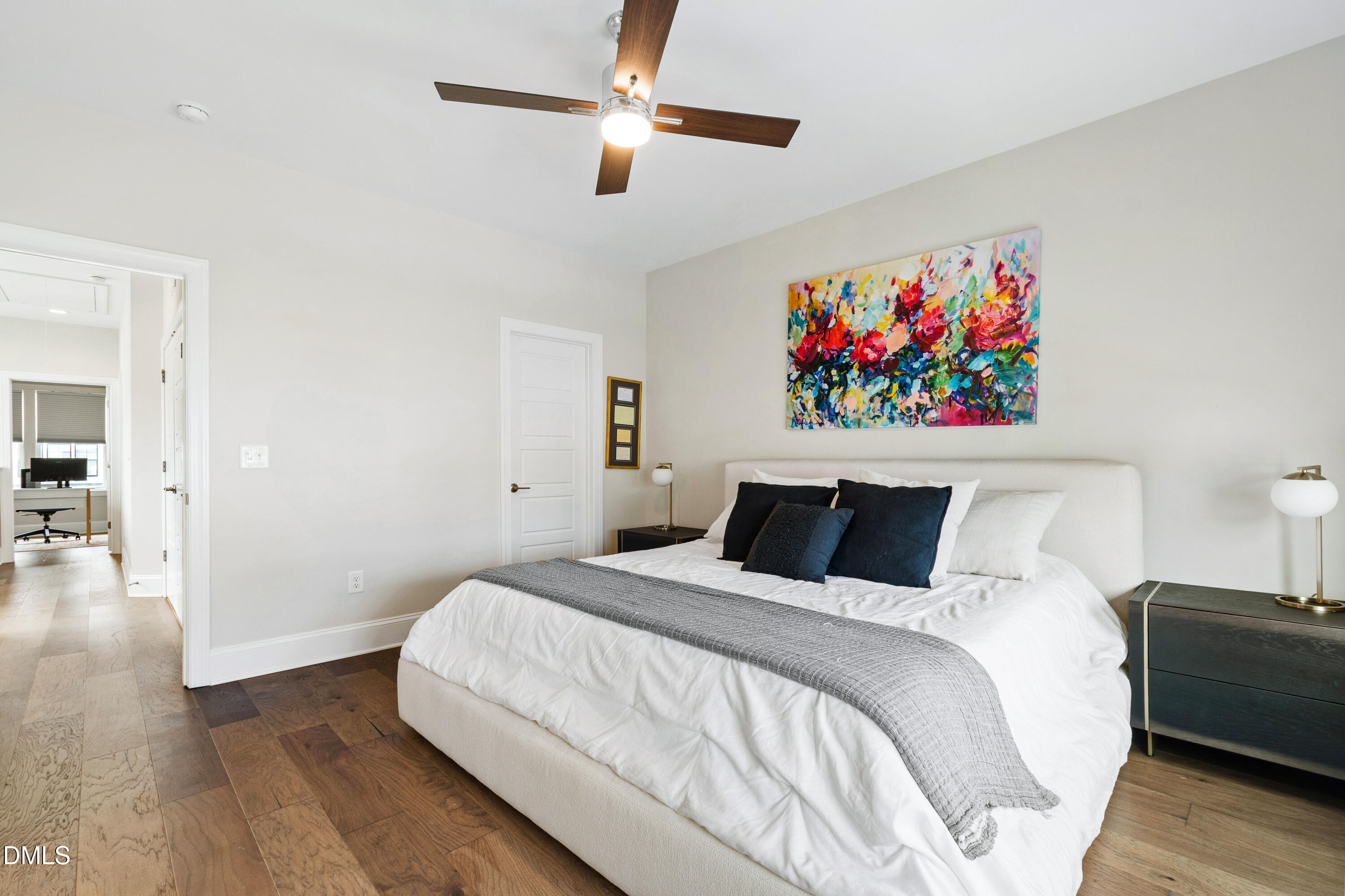 4934 Trek Lane Raleigh, NC 27606 - Photo 22 of 35 a bedroom with a bed and a painting on the wall