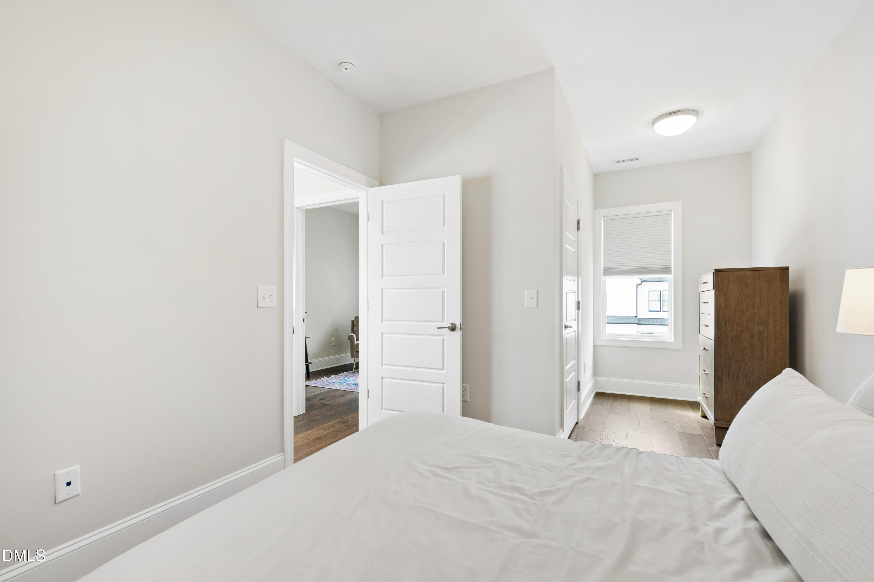 4934 Trek Lane Raleigh, NC 27606 - Photo 26 of 35 a bedroom with a bed and closet