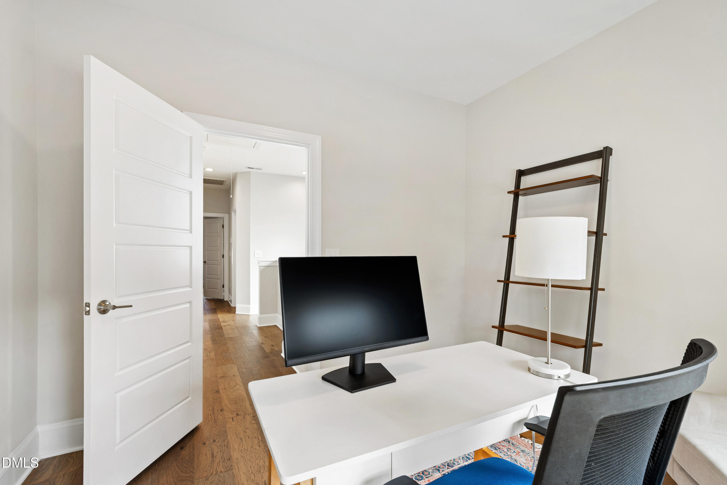 4934 Trek Lane Raleigh, NC 27606 - Photo 28 of 35 a room with a chair and a flat screen tv