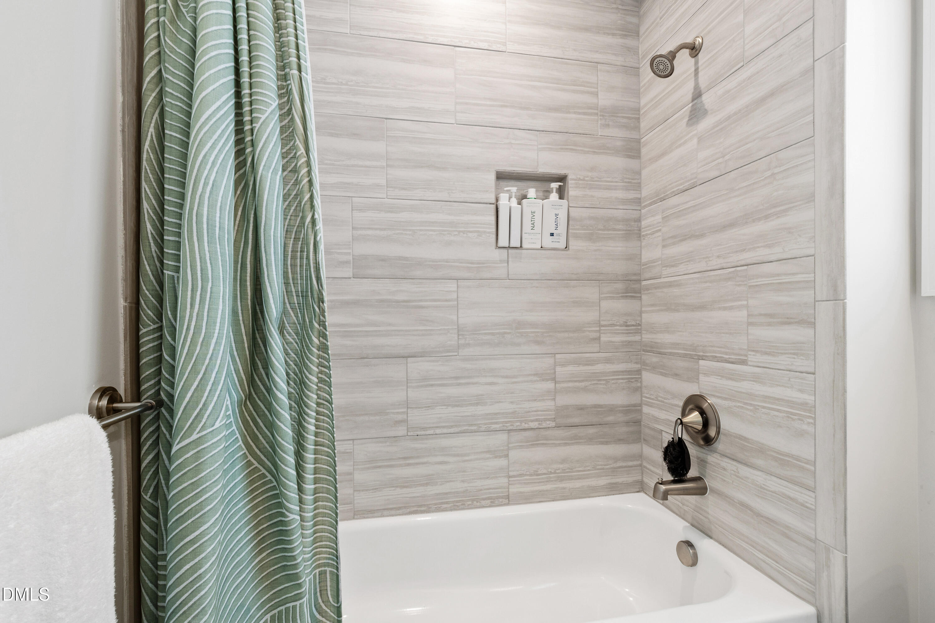 4934 Trek Lane Raleigh, NC 27606 - Photo 30 of 35 a bathroom with a bathtub and shower