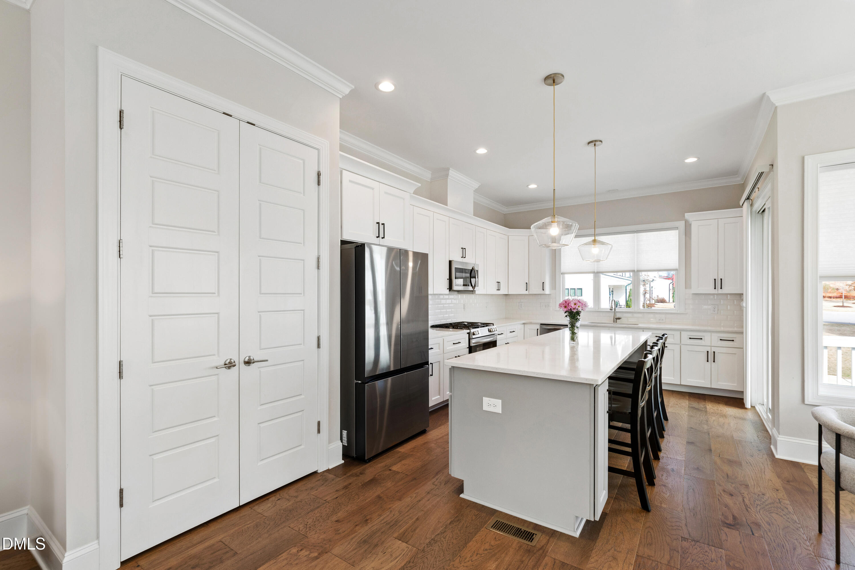 4934 Trek Lane Raleigh, NC 27606 - Photo 6 of 35 a kitchen with a refrigerator a sink and cabinets